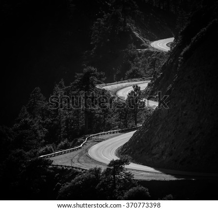 Winding mountain road in black and white