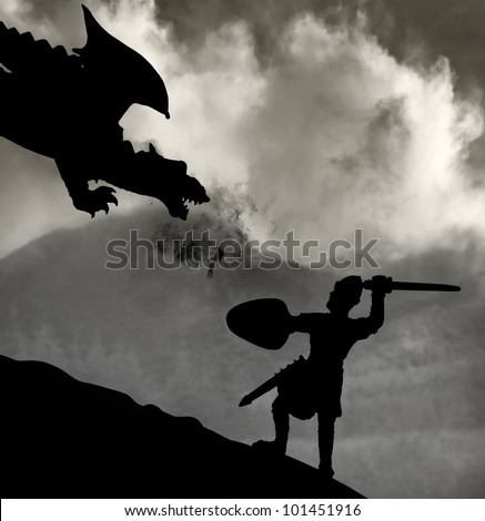 Silhouette of a medieval knight fighting the dragon