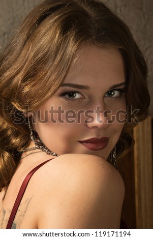 Portrait of the sexy woman in a medieval castle interior