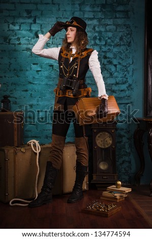 Steam punk girl with suitcase in the hands