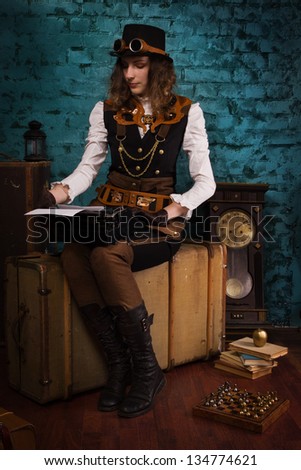 Steam punk girl and old typewriter in a vintage room