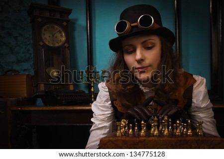 Steam punk girl in a vintage room plays chess