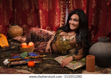 Beautiful arabic woman in the arabic harem interior