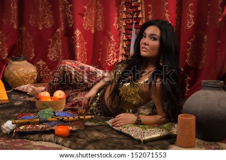 Beautiful arabic woman in the arabic harem interior