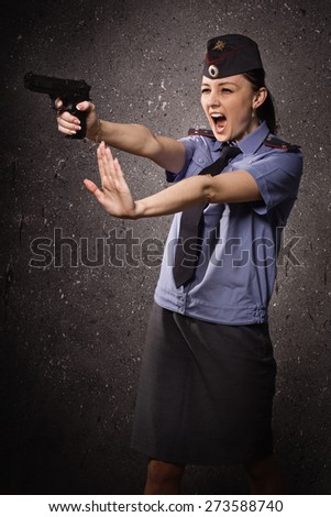 Russian woman police officer shooting with a pistol