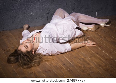 Crime scene. Dead nurse lying on the floor. Low key