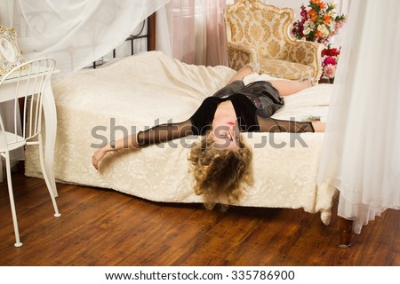 Crime scene simulation. Lifeless woman lying on a bed