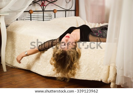 Crime scene simulation. Lifeless woman lying on a bed