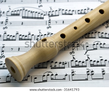 Flute on a musical paper