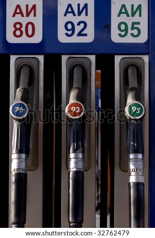 On a gasoline station. Cranes of gasoline station with gasoline types