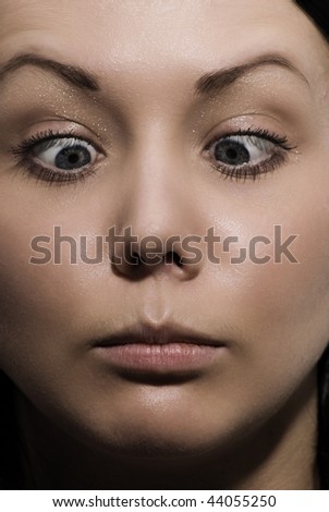 The girl crossed eyes to a nose tip