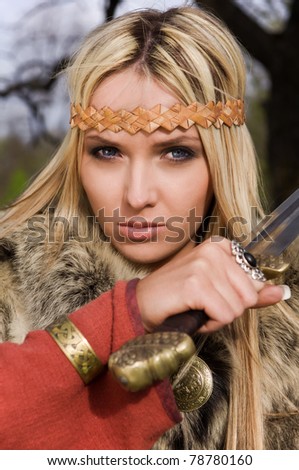 stock photo Portrait of the blonde girl in the Scandinavian suit with