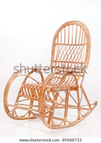 Old wooden rocking chair over white background