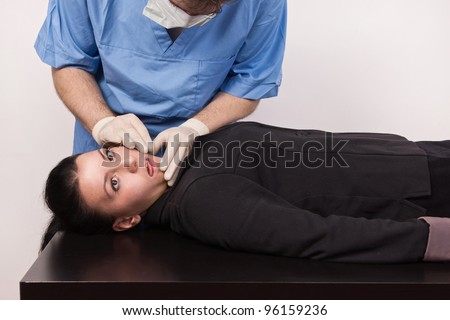 Coroner inspects the body of the crime victim (imitation)