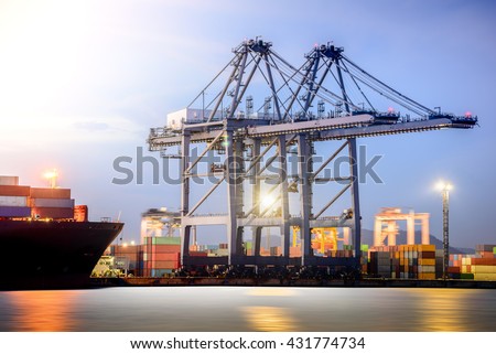 Cargo ship in the Trade Port, Shipping, Logistics, Transportation Systems, Container Cargo freight ship with working crane bridge in shipyard at twilight sky, Logistic Import Export background.