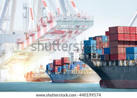 Container cargo ship entering the port with harbor crane background. Freight Transportation. Logistic Import Export background concept.