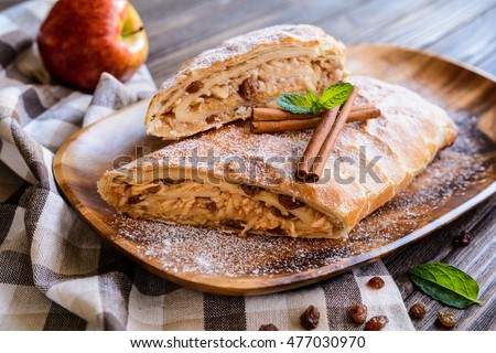 Traditional puff pastry strudel with apple and raisins filling