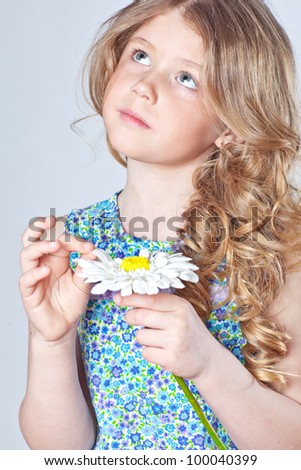 Happy little girl giving flowers.