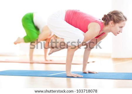Group of sport women in the gym centre doing stretching fitness exercise. Yoga