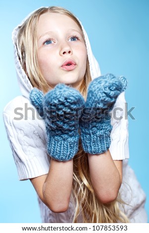 cute little girl in warm hat and gloves