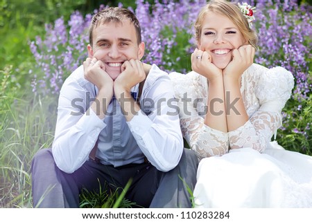 The bride and groom in the spring nature close-up portrait