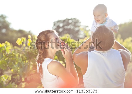 Young and happy family get stroll in the park
