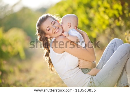 Mother and baby in park portrait