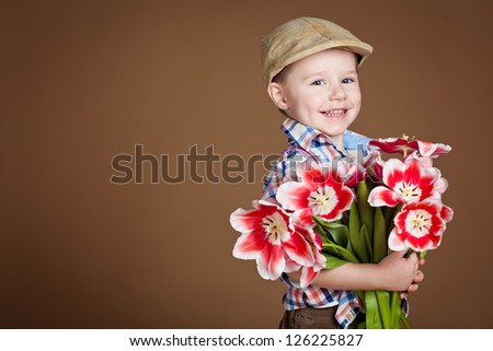 handsome boy with flowers in hands