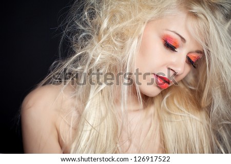 Health and beauty products. Close-up portrait of sensual beautiful woman model face with fashion make-up blonde.