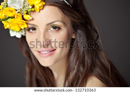portrait of beautiful smiling woman with wreath on her head