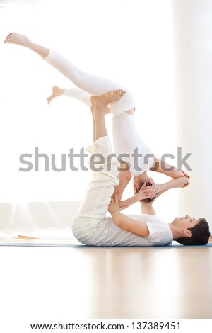 Young couple in yoga pose