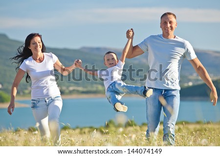 Happy Family Having Fun Outdoors