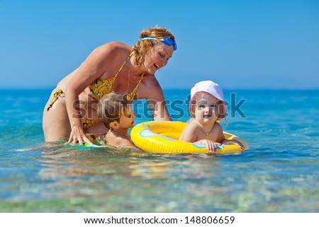 Children learn to swim in the sea