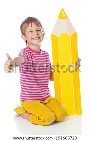 Cute little schoolboy with a pencil and looking at camera Cute little schoolboy with a pencil and looking at camera