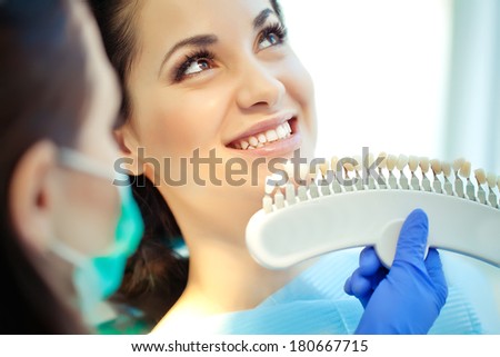 smiling woman with palette for tooth color