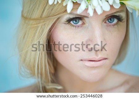 spring portrait girl with wreath of flowers , pastel shades