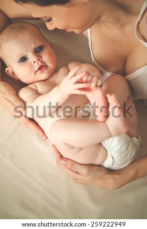 Portrait of a mother with baby, top view point