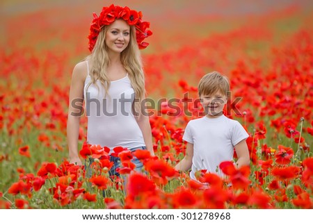 Mom and baby in a field with flowers