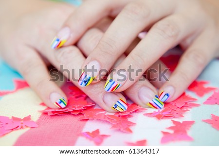 A beautiful woman with bright manicure long nails