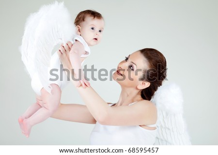 stock photo Angel's mother and a baby angel in the studio on a white 