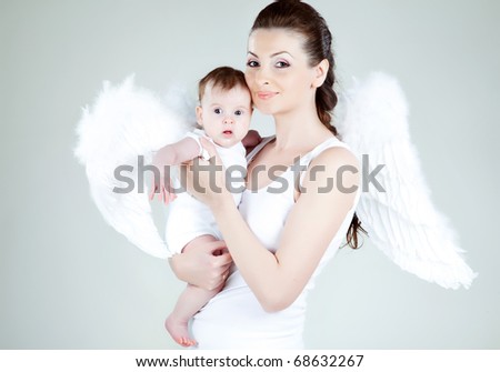 stock photo Beautiful woman with a baby angel angel