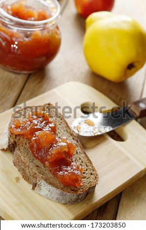 Bread and apple quince jam sandwich on the cut board