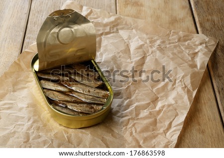 Opened Sprat tin can on the table