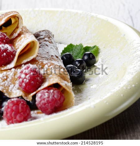 Delicious Tasty Homemade crepes with raspberries