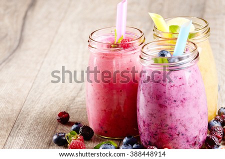 Assorted fruit shakes on white table. Smoothie concept