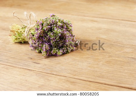 Bunch of thyme herb  on the oak table