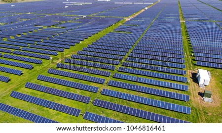 Never ending solar energy farm producing clean renewable energy from the sun . Thousands of solar panels, Photovoltaic solar cells , huge solar farm.