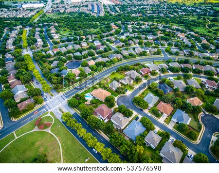 aerial view of green summer time landscape Austin Texas USA homes and suburbia development outside of Round Rock in central Texas