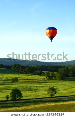 Summer nature with colorful hot air balloon