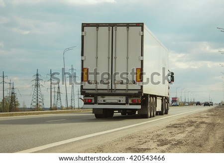 The truck on road. Container on the big highway. transport loads
